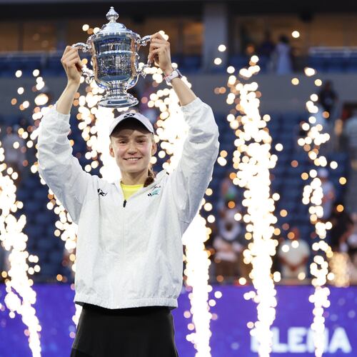 Elena Rybakina, of Kazakhstan, holds up her trophy after winning the women's singles final of the U.S. Open tennis championships against Aryna Sabalenka, of Belarus, Saturday, Sept. 12, 2026, in New York. (AP Photo/Adam Hunger)