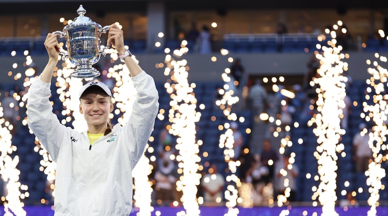 Elena Rybakina, of Kazakhstan, holds up her trophy after winning the women's singles final of the U.S. Open tennis championships against Aryna Sabalenka, of Belarus, Saturday, Sept. 12, 2026, in New York. (AP Photo/Adam Hunger)