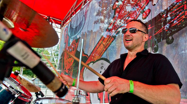Rich Simmons from the band The Georgia Flood performs during the Decatur BBQ, Blues & Bluegrass Festival at Harmony Park in Decatur on Saturday, August 16, 2014. The 14th annual festival featured over seven hours of blues and bluegrass performances as well as beer, barbeque and children's activities.