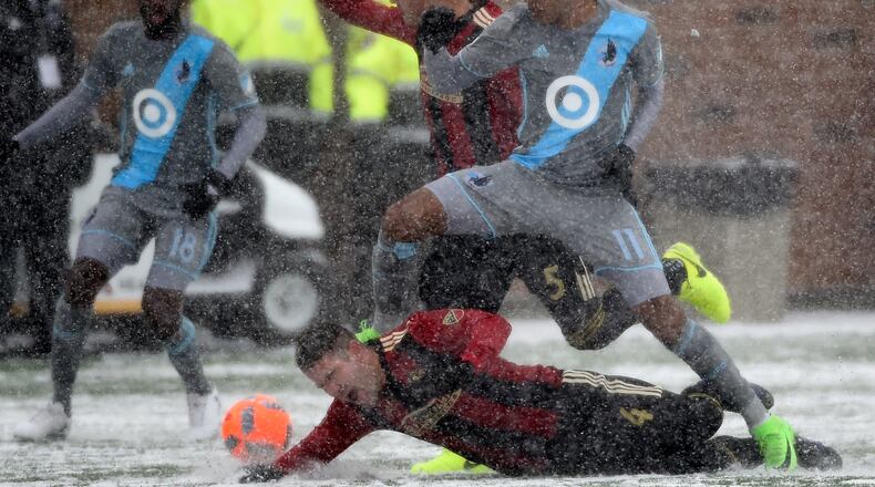 MINNEAPOLIS, MN - MARCH 12: Johan Venegas #11 of Minnesota United FC challenges Greg Garza #4 and Leandro Gonzalez Pirez #5 of Atlanta United FC for the ball during the first half of the match on March 12, 2017 at TCF Bank Stadium in Minneapolis, Minnesota. (Photo by Hannah Foslien/Getty Images)