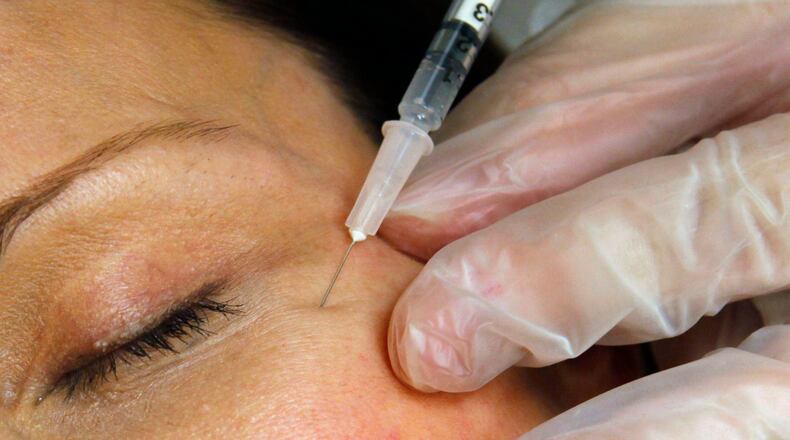 FILE - A patient receives a Botox injection at a clinic in Arlington, Va., on June 5, 2009. (AP Photo/Jacquelyn Martin, File)