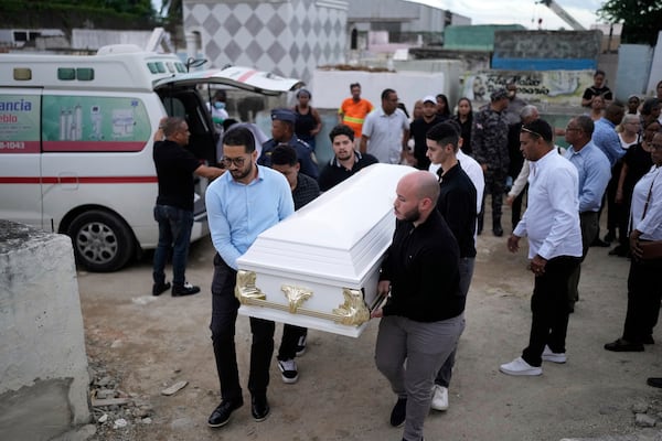 Relatives carry the coffin that contain the remains of Marilenny Pilarte who died at the Jet Set nightclub when its roof collapsed, during a burial service at a cemetery in Haina, Dominican Republic, Thursday, April 10, 2025. (AP Photo/Matias Delacroix)