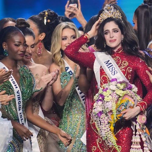 Miss Mexico Fatima Bosch, center, is celebrated by other contesters after winning the 2025 Miss Universe pageant in Nonthaburi, north of Bangkok, Thailand, Friday, Nov. 21, 2025. (AP Photo/Sakchai Lalit)