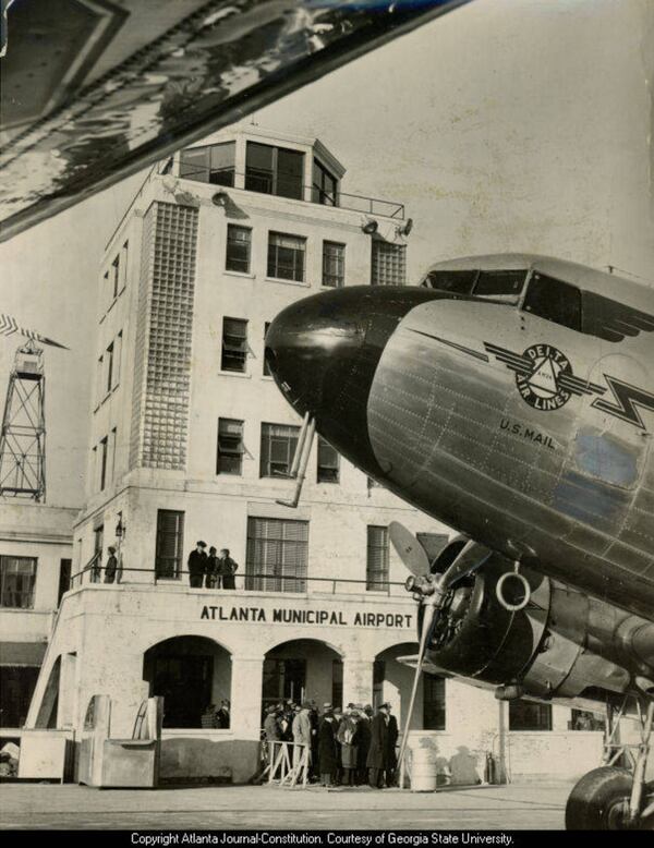 A Delta Air Lines mail plane at Atlanta Municipal Airport in 1941. Delta moved its headquarters from Monroe, Louisiana, to Atlanta in 1941. (AJC 1941/Courtesy of Georgia State University)