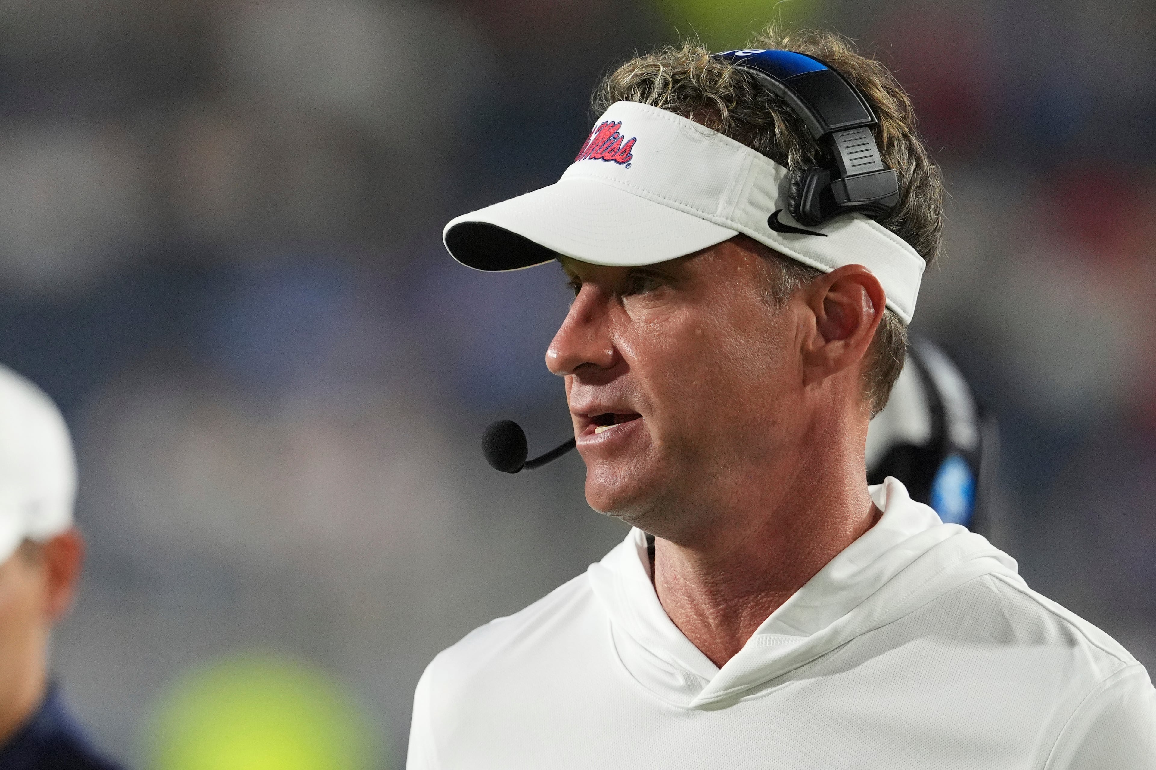 Mississippi head coach Lane Kiffin speaks to his coaches in the booth during the second half against Georgia State on Saturday, Aug. 30, 2025, in Oxford, Miss. Kiffin says he gave up alcohol and is more focused on spending quality time with his kids. (Rogelio V. Solis/AP)