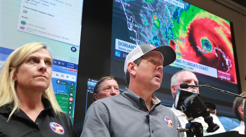 September 2, 2019 Brunswick: Georgia Gov. Brian Kemp, with his wife Marty and other officials, holds a Hurricane Dorian briefing at the Glynn County Public Safety Complex on Sept. 2, 2019, in Brunswick.   Curtis Compton/ccompton@ajc.com