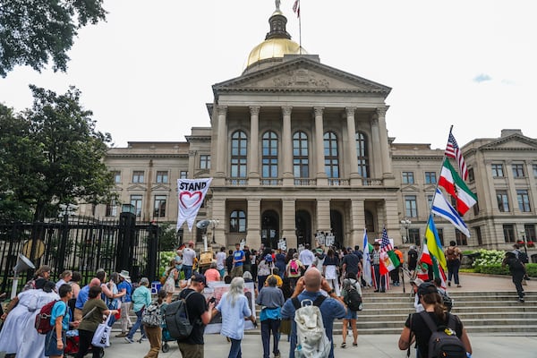 Faith leaders and demonstrators march during the Pilgrimage for Voting Rights at Liberty Plaza in Atlanta on Wednesday. (Abbey Cutrer/AJC)