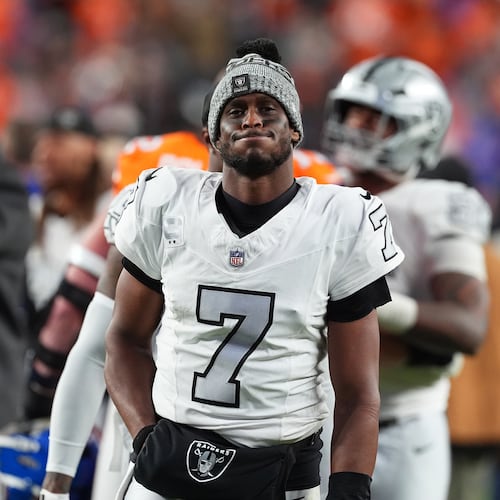 Las Vegas Raiders quarterback Geno Smith heads off the field after an NFL football game against the Denver Broncos, Thursday, Nov. 6, 2025, in Denver. (AP Photo/David Zalubowski)