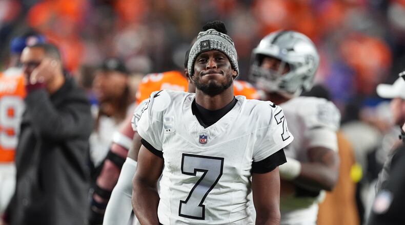 Las Vegas Raiders quarterback Geno Smith heads off the field after an NFL football game against the Denver Broncos, Thursday, Nov. 6, 2025, in Denver. (AP Photo/David Zalubowski)