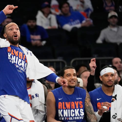 New York Knicks' Jalen Brunson reacts while watching from the bench during the second half of Game 1 in a second-round NBA basketball playoffs series against the Philadelphia 76ers Monday, May 4, 2026, in New York. (AP Photo/Seth Wenig)