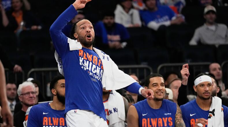 New York Knicks' Jalen Brunson reacts while watching from the bench during the second half of Game 1 in a second-round NBA basketball playoffs series against the Philadelphia 76ers Monday, May 4, 2026, in New York. (AP Photo/Seth Wenig)
