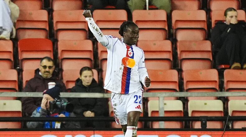 OL Lyonnes' Tabitha Chawinga celebrates scoring their side's first goal during a women's Champions League soccer match against Manchester United, Wednesday, Dec. 10, 2025, in Leigh, England. (Martin Rickett/PA via AP)