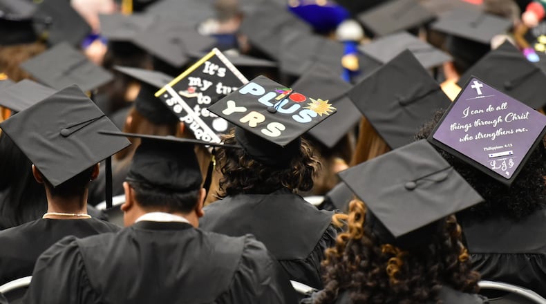 April Lewis, 64, wears her mortarboard that says “40 PLUS YRS” during fall 2017 commencement exercises on Tuesday, Dec. 12, 2017 at Georgia State University’s Perimeter campus. Lewis, 64, and her sister Mae Brown, 67, began their college careers in the 1970s, but it’s taken them a few years to graduate. Their studies were interrupted by jobs, childbirths, family illnesses, etc. HYOSUB SHIN / HSHIN@AJC.COM