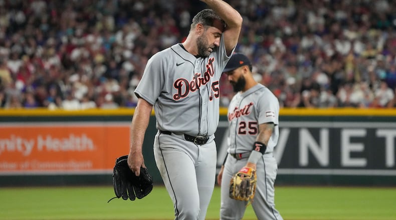Detroit Tigers pitcher Justin Verlander wipes his brow as he walks off the field during the fourth inning of an opening-day baseball game against the Arizona Diamondbacks Monday, March 30, 2026, in Phoenix. (AP Photo/Darryl Webb)