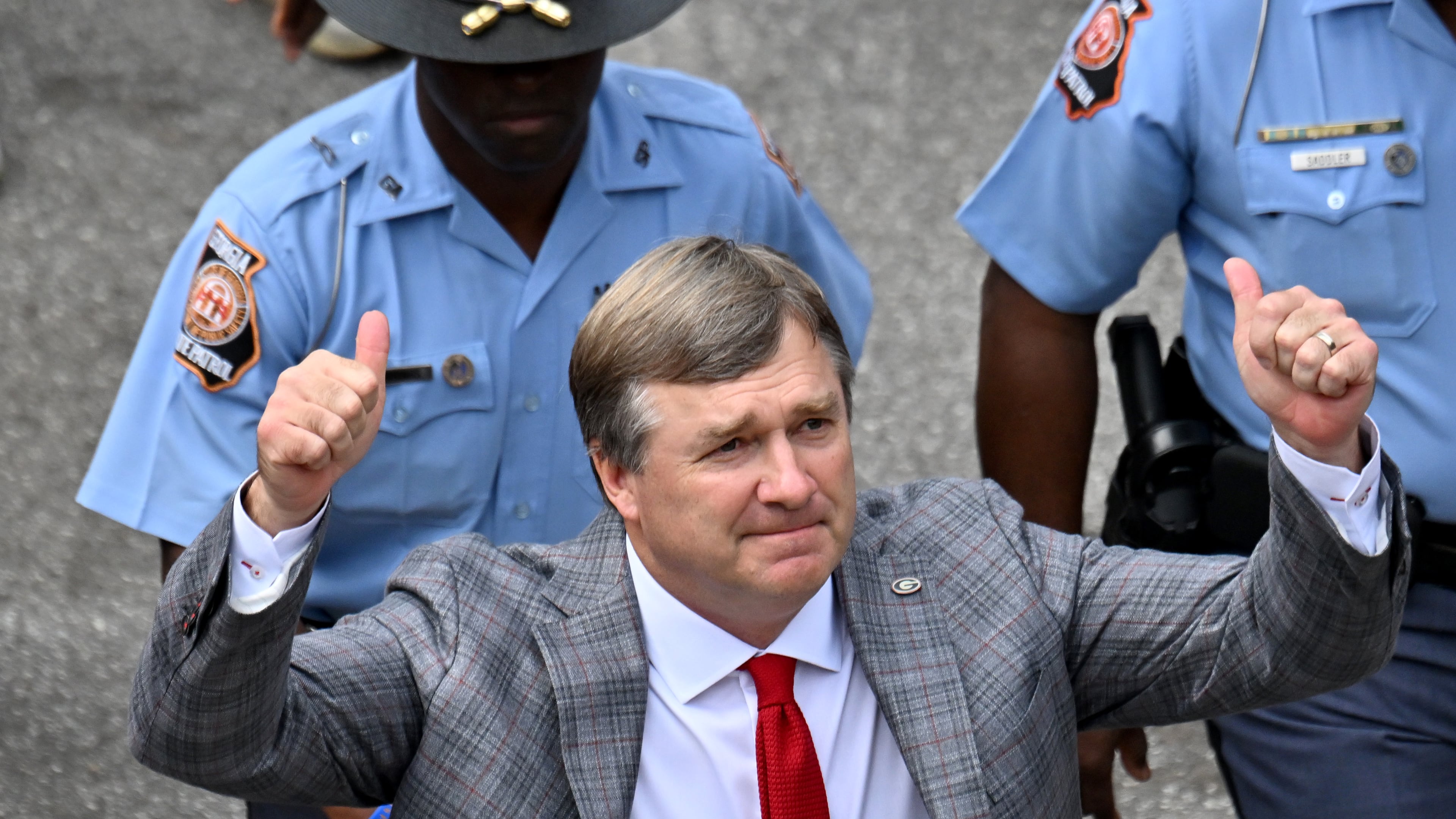 Georgia head coach Kirby Smart waves as players and coaching staff arrive during Dawgs Walk before an NCAA football game against Mississippi at Sanford Stadium, Saturday, Oct. 18, 2025, in Athens. (Hyosub Shin/AJC)