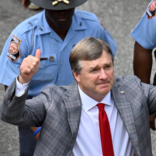 Georgia head coach Kirby Smart waves as players and coaching staff arrive during Dawgs Walk before an NCAA football game against Mississippi at Sanford Stadium, Saturday, Oct. 18, 2025, in Athens. (Hyosub Shin/AJC)