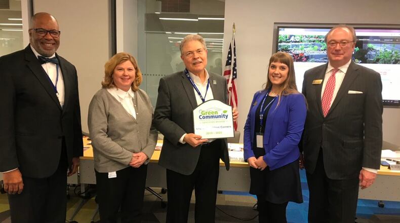 Recognizing Peachtree Corners as a Green Community: l-r, Doug Hooker, ARC’s executive director, Peachtree Corners Economic Development Manager Jennifer Howard, Peachtree Corners Mayor Mike Mason, ARC’s Sustainability Coordinator Kelsey Waidhas and Kerry Armstrong, ARC’s chairman of the board. (Courtesy Peachtree Corners)