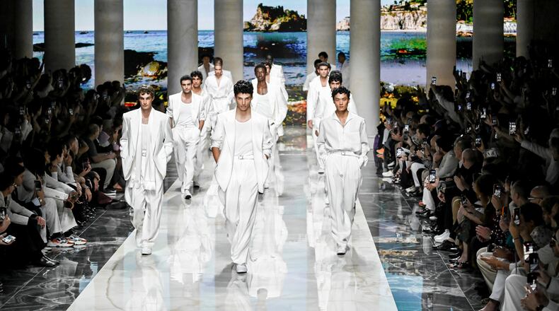 Models wear creations from the Dolce & Gabbana Spring/Summer 2027 Men's collection presented in Milan, Italy, Saturday, June 20, 2026. (AP Photo/Nicola Marfisi)