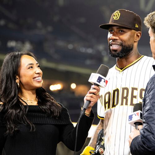 FILE - San Diego Padres' Jason Heyward, center, is interviewed by Mariluz Cook, left, and Mike Pomeranz following a baseball game against the Colorado Rockies, April 12, 2025, in San Diego. (AP Photo/Derrick Tuskan, File)