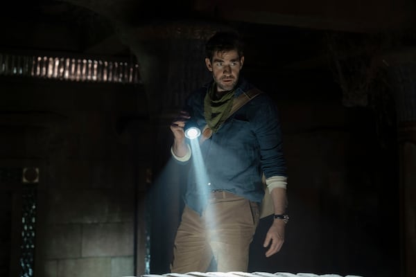 This image released by Apple TV+ shows John Krasinski in a scene from the film "Fountain of Youth." (Christopher Raphael/Apple TV+ via AP)