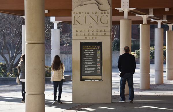 Visitors walk around the Martin Luther King Jr. National Historical Park in Atlanta on Dec. 22, 2018. (Hyosub Shin/AJC)