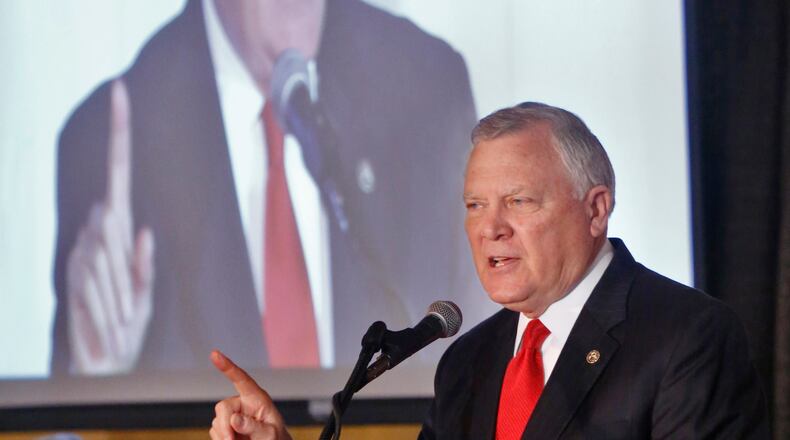 Dec. 9, 2014 - Athens - Gov. Nathan Deal speaks at the Biennial Institute for Georgia Legislators at UGA. Gov. Nathan Deal outlined his legislative agenda at the Biennial Institute for Georgia Legislators, and then at the 2014 Transportation Summit, hosted by the Georgia Transportation Alliance, in partnership with the American Council of Engineering Companies of Georgia, both in Athens. Georgia Republicans are laying the groundwork for a monumental push to raise new revenue to fund infrastructure improvements BOB ANDRES / BANDRES@AJC.COM Deal addresses legislators in Athens. AJC photo / Bob Andres