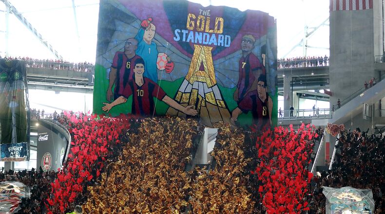 July 15, 2018 Atlanta: Atlanta United fans set a new MLS record attendance of 72,243 hoisting a tifo against the Seattle Sounders during the first half in a MLS soccer match on Sunday, July 15, 2018, in Atlanta. Curtis Compton/ccompton@ajc.com