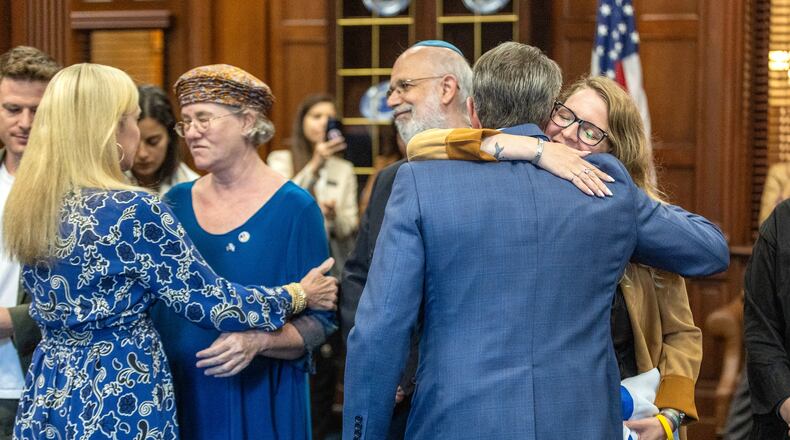 Gov. Brian Kemp and first lady Marty Kemp welcome an Israeli delegation to the Georgia Capitol on Tuesday. They met with relatives of civilians who were taken hostage by Hamas militants. “To hear it from victims and family members makes it more real, but also unreal, that something like this could happen,” the governor said. (Steve Schaefer/steve.schaefer@ajc.com)