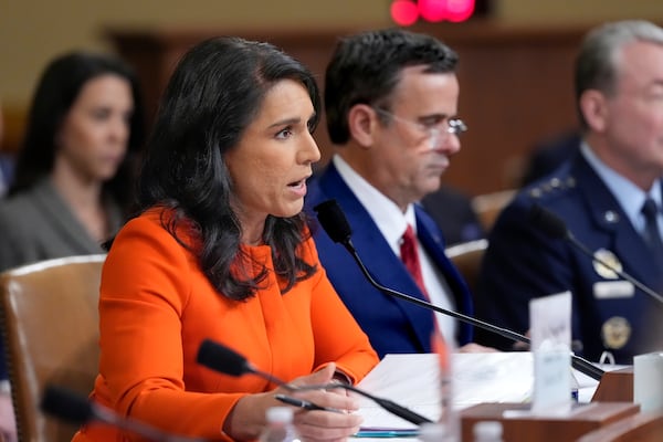 Director of National Intelligence Tulsi Gabbard, left, joined by CIA Director John Ratcliffe, testifies as the House Intelligence Committee holds a hearing on worldwide threats, at the Capitol, in Washington, Wednesday, March 26, 2025. (AP Photo/J. Scott Applewhite)