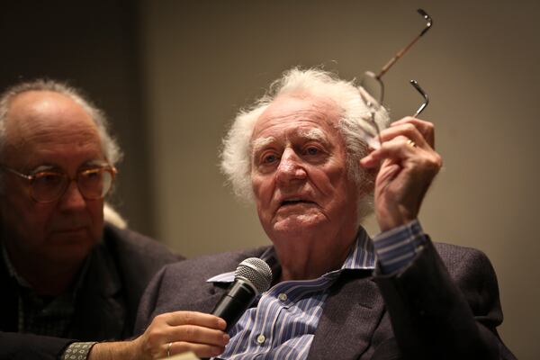 Poet Robert Bly reads from his book "Stealing Sugar from the Castle" at the University of Minnesota in October 2013. Holding his microphone is poet Thomas R. Smith. Bly died at age 94. (Renee Jones Schneider/Minneapolis Star Tribune/TNS)