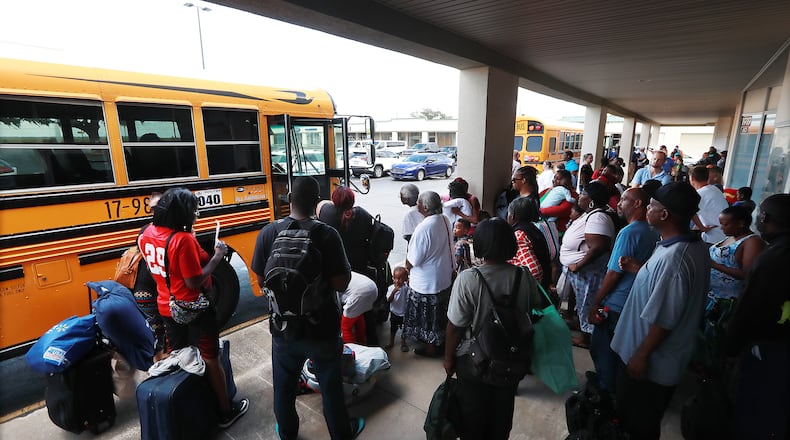 Hundreds of local residents in Brunswick board buses Monday at Lanier Plaza under a mandatory evacuation ahead of Hurricane Dorian for a inland shelter in Columbus. Curtis Compton/ccompton@ajc.com