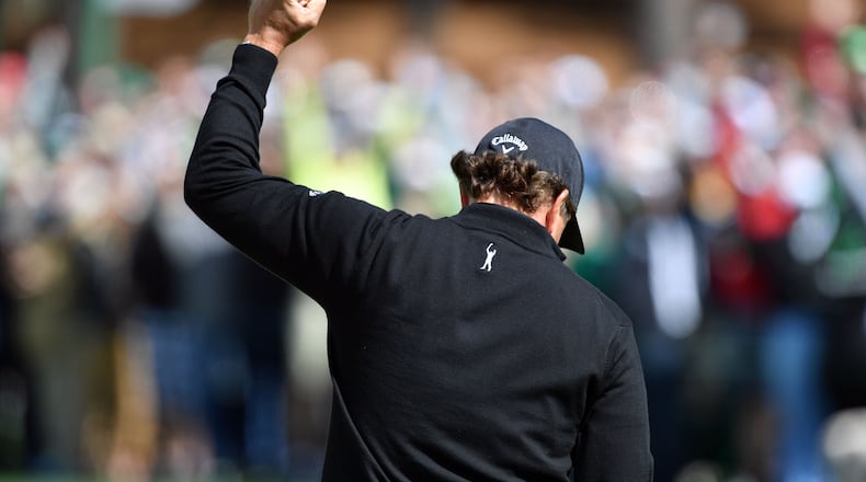 Phil Mickelson has another Masters moment, rejoicing over an eagle on No. 2 Thursday. (Brant Sanderlin/Special)