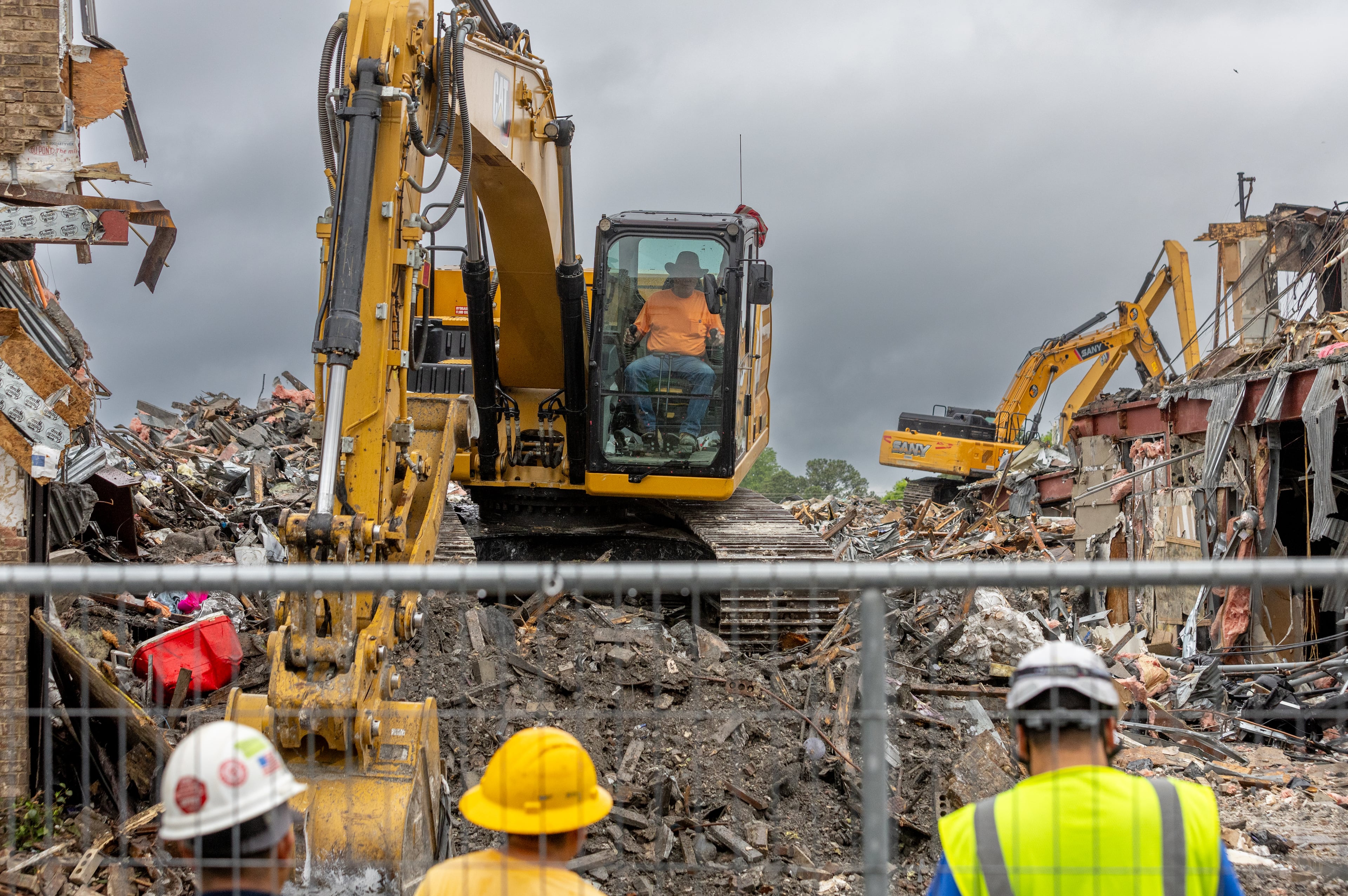 Demolition continued on April 11, 2024, at The Reserve at LaVista Walk apartments in northeast Atlanta. Contractors began tearing down the crumbling building that went up in flames in November 2023. (Photo by John Spink/AJC)