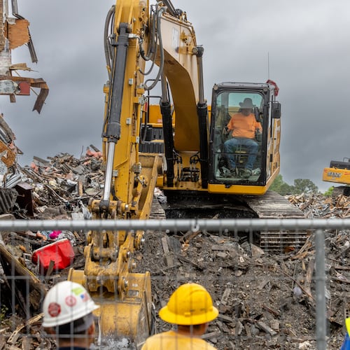 Demolition continued on April 11, 2024, at The Reserve at LaVista Walk apartments in northeast Atlanta. Contractors began tearing down the crumbling building that went up in flames in November 2023. (Photo by John Spink/AJC)