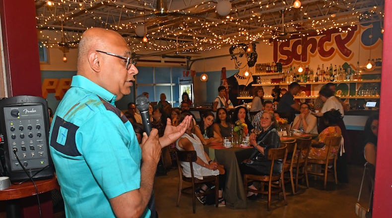 Chef and author Vishwesh Bhatt greets guests at the sold-out multicourse meal and event celebrating his newly released cookbook, ”I Am From Here: Stories and Recipes From a Southern Chef” (Norton, $37.50), on Aug. 9, 2022, at Chai Pani in downtown Decatur. (Chris Hunt for the AJC)