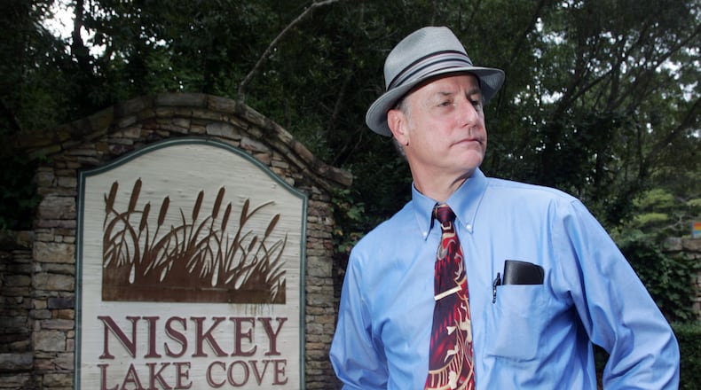 Retired Atlanta homicide detective Danny Agan talks at the entrance to Niskey Lake Cove subdivision off Niskey Lake Road in Southwest Atlanta, near where the first two bodies linked to the Atlanta child murders were found.