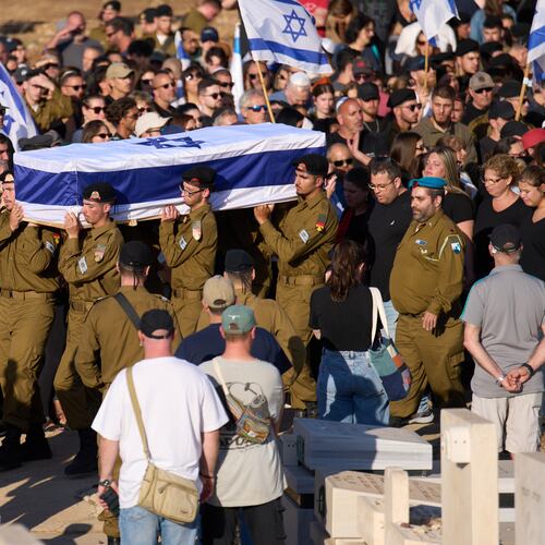 Israeli soldiers carry the casket of Staff sergeant Noam Hamburger, who was killed in a Lebanese drone attack on northern Israel, during his funeral in Atlit, Israel, Sunday, May 24, 2026. (AP Photo/Ariel Schalit)