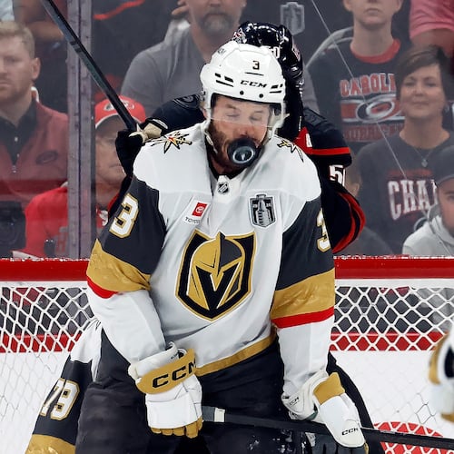Vegas Golden Knights' Brayden McNabb takes a puck to the face during the first period in Game 2 of the NHL hockey Stanley Cup Final series against the Carolina Hurricanes in Raleigh, N.C., Thursday, June 4, 2026. (AP Photo/Karl DeBlaker)