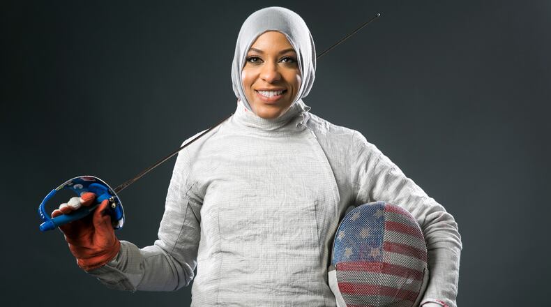 Fencer Ibtihaj Muhammad poses for photos at the 2016 Team USA Media Summit , in Beverly Hills, Calif. (AP Photo/Damian Dovarganes)