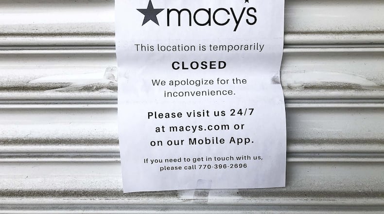 A sign informs customers of the temporary closure of Macy’s at Perimeter Center Mall in Dunwoody. Many stores in the mall, including Macy’s and Nordstrom, are closed until further notice due to COVID-19. (ALYSSA POINTER/ALYSSA.POINTER@AJC.COM)