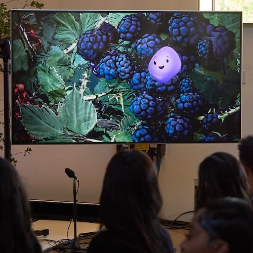 A video animation shows a Copilot Appearance avatar called Mico, floating around an abstract environment during a presentation at Microsoft's Fall 2025 Copilot Sessions event on Wednesday, Oct. 22, 2025, in Los Angeles. (AP Photo/Damian Dovarganes)