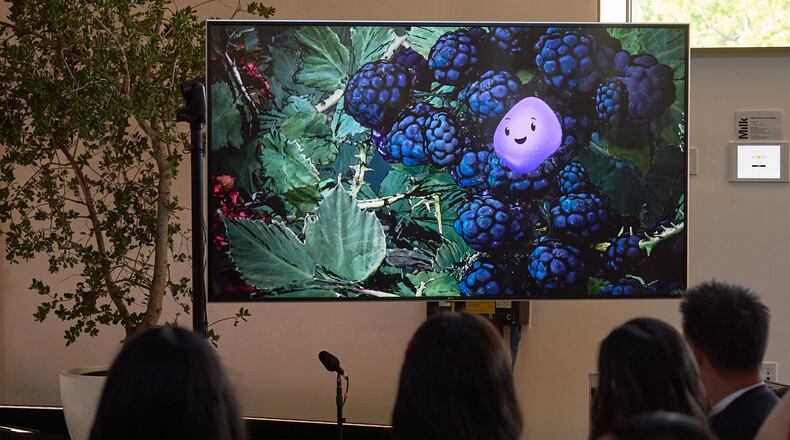 A video animation shows a Copilot Appearance avatar called Mico, floating around an abstract environment during a presentation at Microsoft's Fall 2025 Copilot Sessions event on Wednesday, Oct. 22, 2025, in Los Angeles. (AP Photo/Damian Dovarganes)