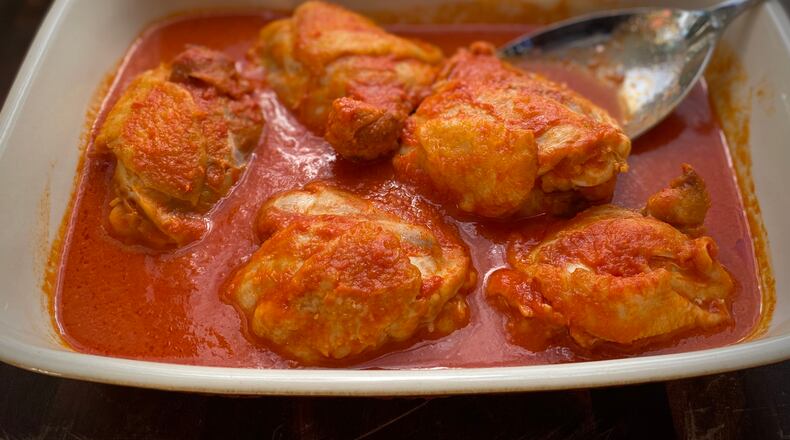 Spin a few key ingredients into easy, elegant dinners with "The Ultimate 5-Ingredient Cookbook." This dish is Tomato and Horseradish-Braised Chicken Thighs. (Kellie Hynes for The Atlanta Journal-Constitution)