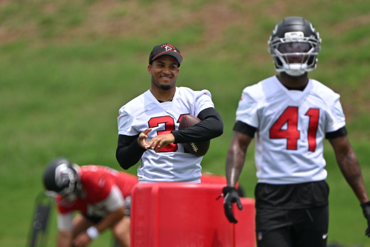 Atlanta Falcons safety Xavier Watts (center) watches during an OTA workout at Atlanta Falcons Training Facility on Wednesday, May 27, 2026, in Flowery Branch. (Hyosub Shin/AJC)