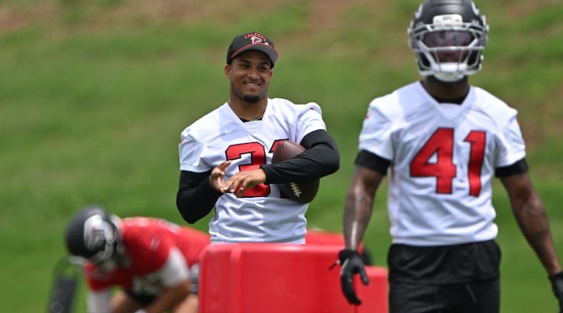 Atlanta Falcons safety Xavier Watts (center) watches during an OTA workout at Atlanta Falcons Training Facility on Wednesday, May 27, 2026, in Flowery Branch. (Hyosub Shin/AJC)