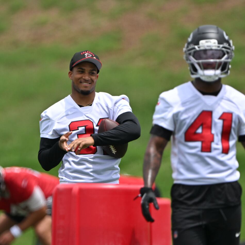 Atlanta Falcons safety Xavier Watts (center) watches during an OTA workout at Atlanta Falcons Training Facility on Wednesday, May 27, 2026, in Flowery Branch. (Hyosub Shin/AJC)