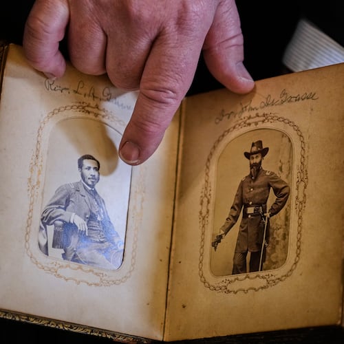 Portraits of Mass. Rep. Charles Lewis Mitchell, left, and Dr. John V. de Grasse are shown from an photograph album from the personal collection of anti-slavery activist Harriet Hayden, which was printed in the 1860's, at the Boston Athenaeum, Thursday, Oct. 9, 2025, in Boston. (AP Photo/Charles Krupa)