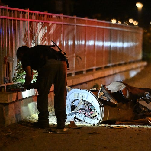 Israeli security forces examine a fragment of an intercepted Iranian missile in northern Israel, early Monday, June 8, 2026. (AP Photo/Rami Shlush)