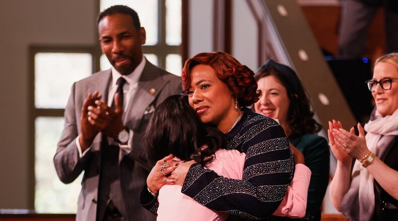 FILE - Bernice A. King, facing forward, hugs Siara White after her tribute to Coretta Scott King during the Martin Luther King Jr. Beloved Community Commemorative Service at Ebenezer Baptist Church in Atlanta, Jan. 19, 2026. (Abbey Cutrer/Atlanta Journal-Constitution via AP, File)