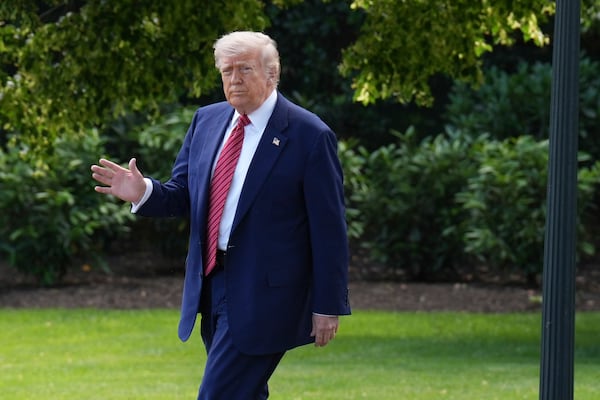 President Donald Trump waves as he departs the White House, Friday, May 23, 2025, in Washington. (AP Photo/Jacquelyn Martin)